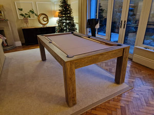 7' Santa Fe Walnut Rosetta pool dining table converted into a pool table with cues and a beige playing surface.