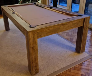 Close-up of the 7' Santa Fe Walnut Rosetta pool dining table in pool table mode with a beige playing surface.